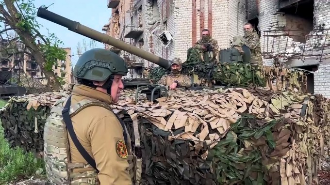 Wagner boss Yevgeny Prigozhin talks with soldiers in Bakhmut in this photo released on May 25. Photo: AFP