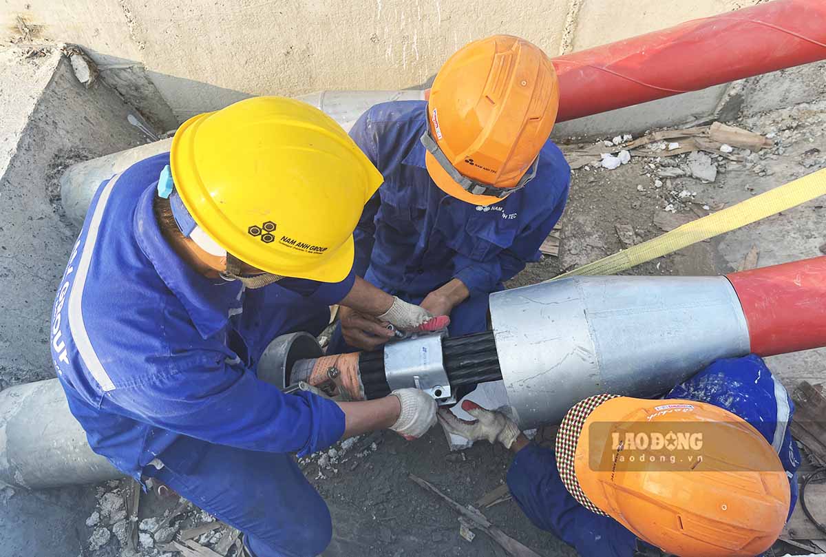 Workers are checking the cable bundles again.