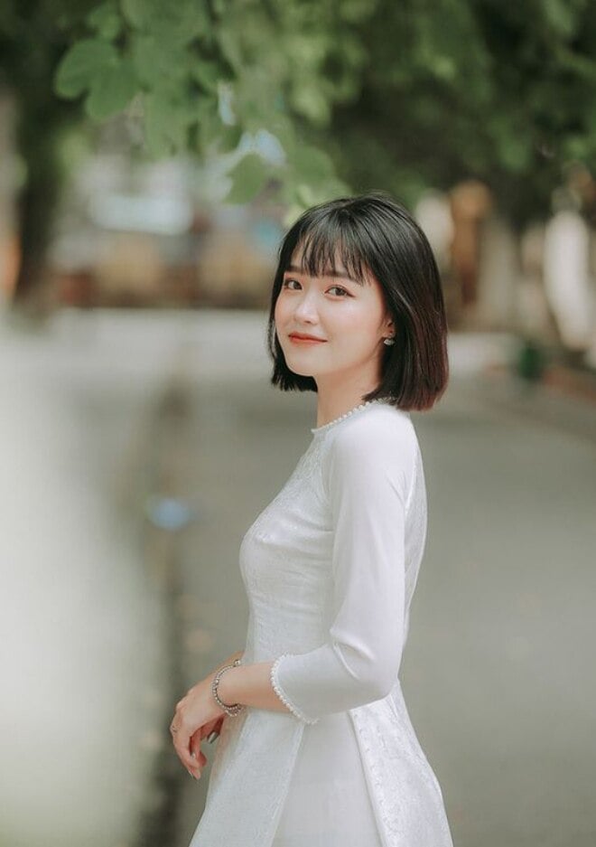 Trendy Kurzhaarfrisuren helfen Ihnen, Ihre Persönlichkeit mit Ao Dai zu zeigen - 1