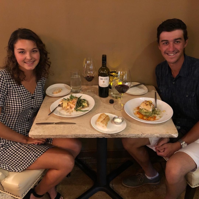 Leah Bertuccelli (left) at a meal with her boyfriend Pereira in 2019, before she was diagnosed with cancer. Photo: Instagram