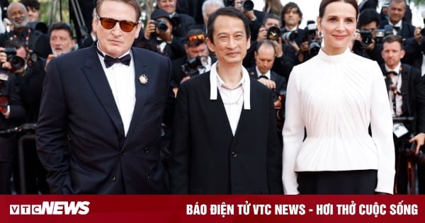 Tran Anh Hung hugs and kisses his wife amid 7-minute applause at Cannes