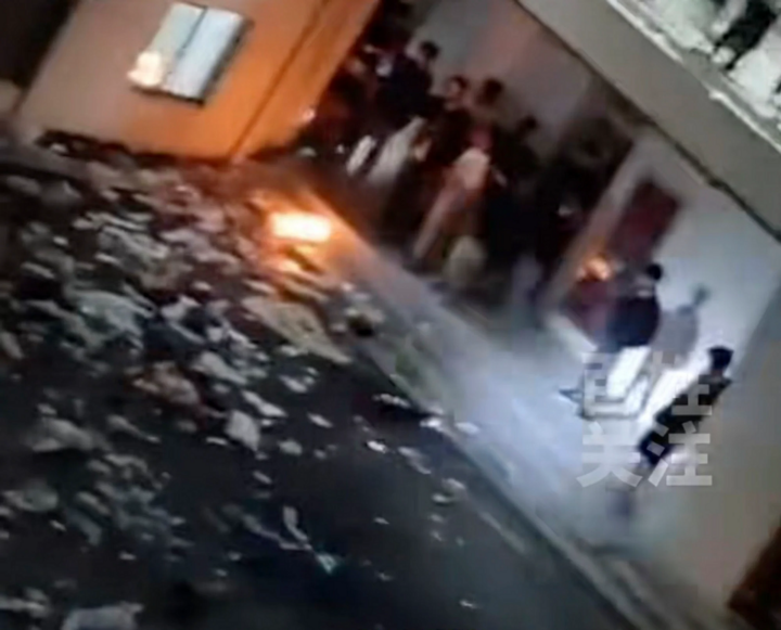 Angry students threw paper and clothes on the floor and set fires in the dormitory grounds. (Photo: SCMP)