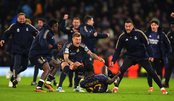 Real players celebrate with Rudiger after the centre-back scored the decisive penalty. Photo: PA