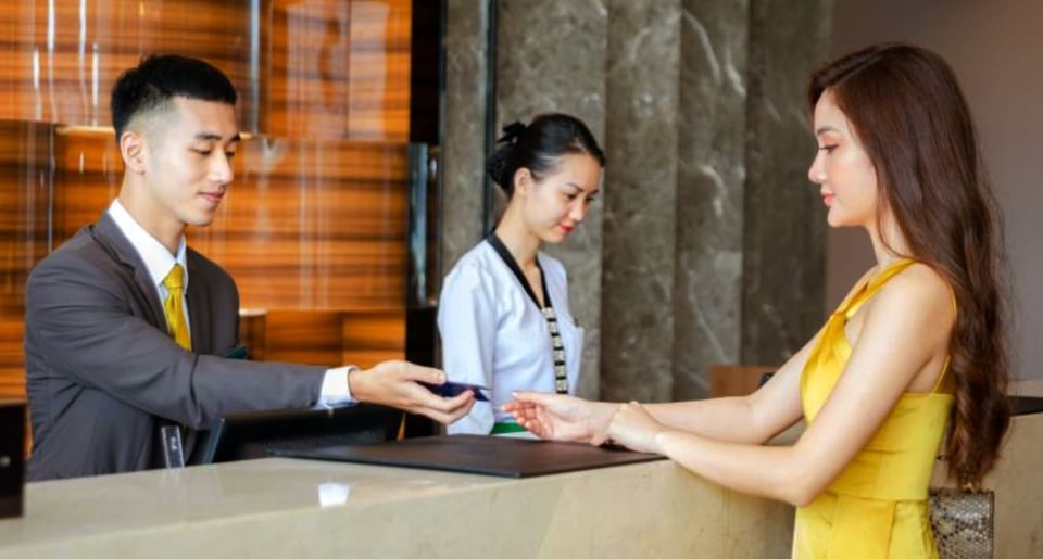 Hotel staff check in guests. Photo: Hoai Nam