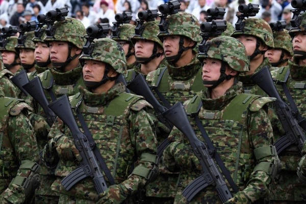 Short of soldiers, Japan increases technology application and military spending