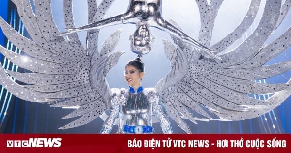 Miss Universe contestants perform in costumes named 'Quoc Co - Quoc Nghiep'