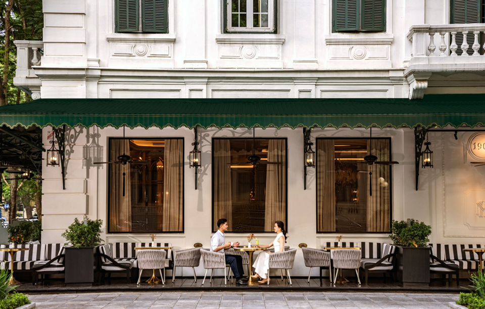 Tourists enjoy coffee at Sofitel Legend Metropole Hanoi Hotel. Photo: Hoai Nam