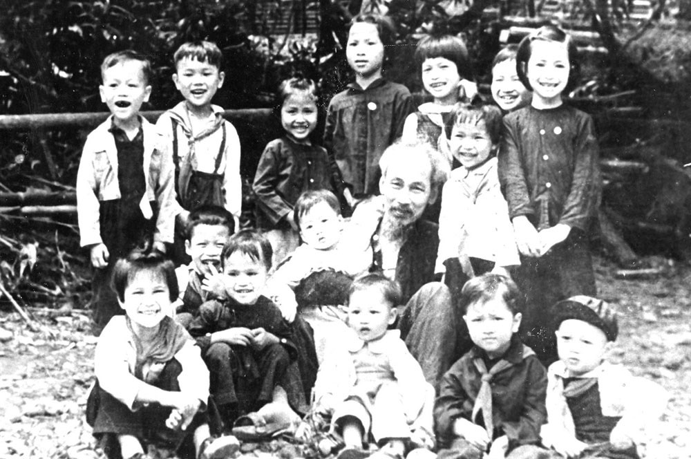 President Ho Chi Minh with children at ATK Dinh Hoa, Thai Nguyen, 1951. Photo: Document