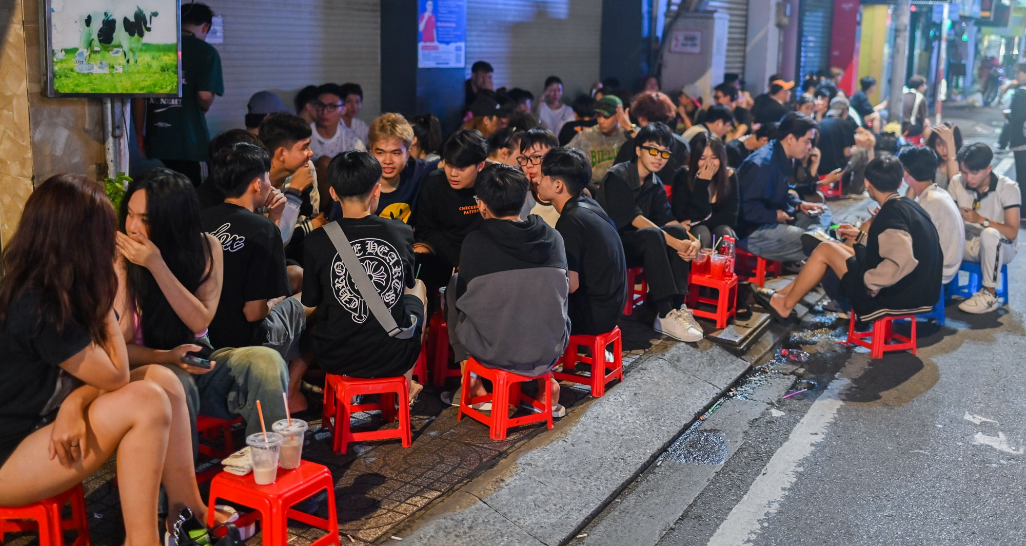 Sitting on the sidewalk drinking 15,000 VND filter coffee all night in Ho Chi Minh City