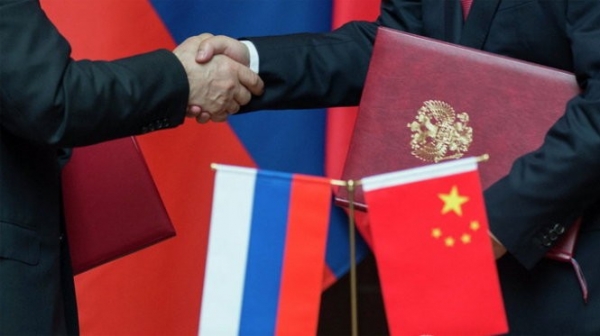 Russia says it has unprecedented level of cooperation with China; signs deal to build nuclear reactor with India