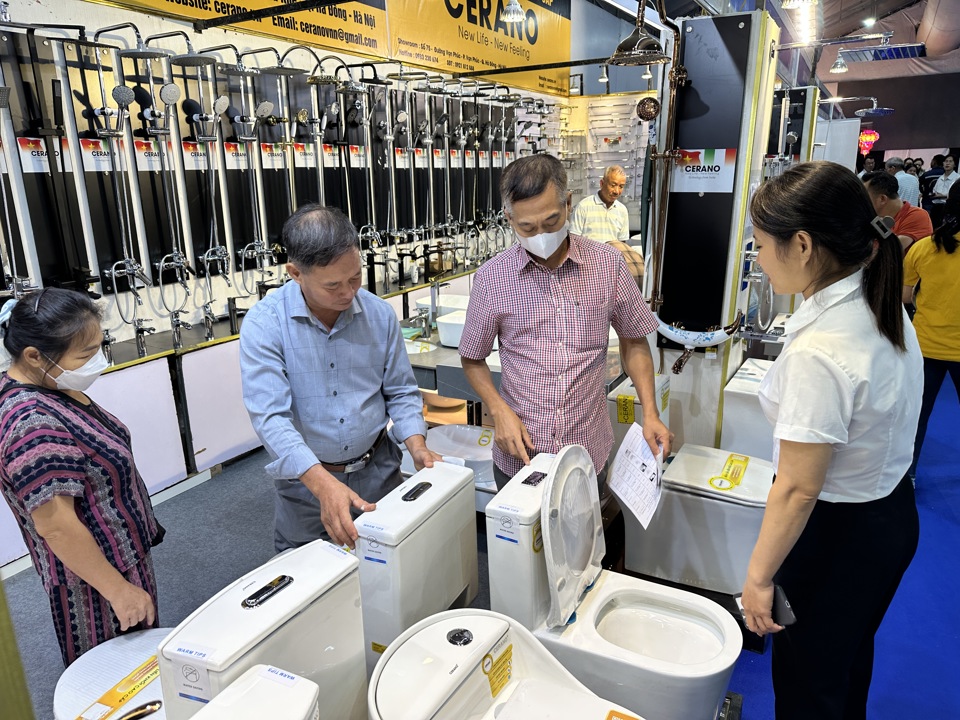 Customers visit and experience sanitary equipment products.