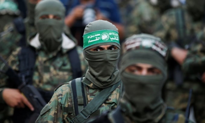 Des hommes armés du Hamas participent à une marche de protestation anti-israélienne dans la ville de Gaza en mai 2021. Photo : Reuters