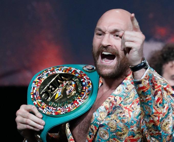 Fury at a press conference with the WBC belt. Photo: Reuters