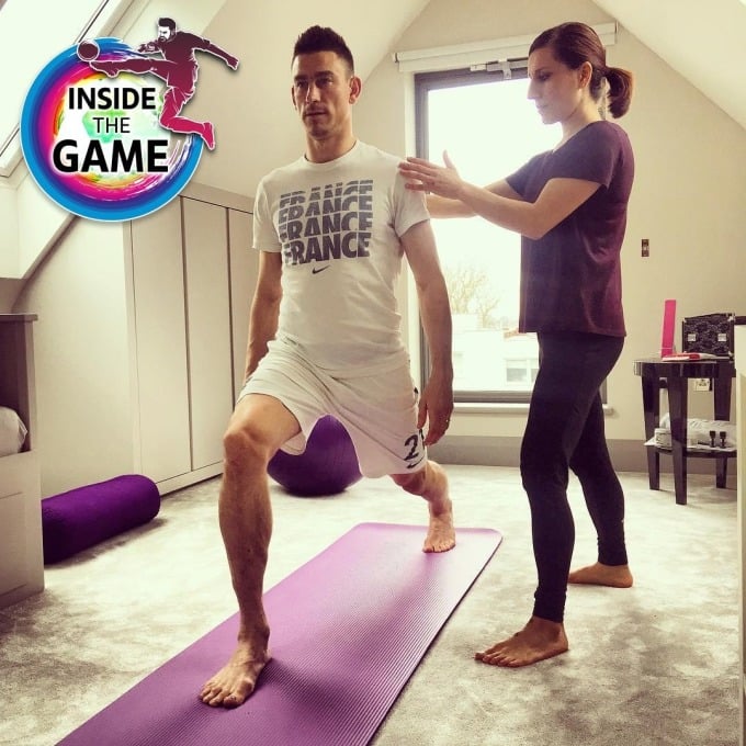 Heidaripour guides Kocielny through yoga. Photo: sharon_footballyoga