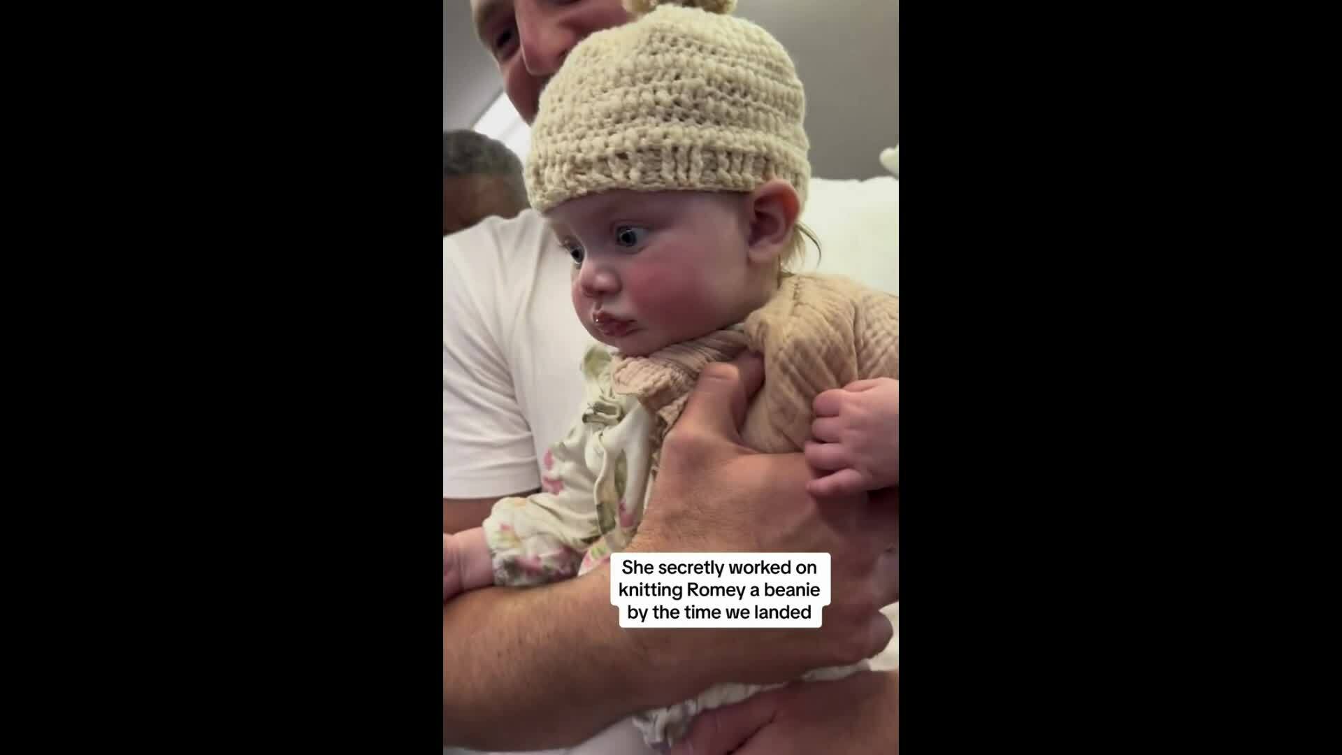 Stranger knits a woolen hat for a baby on the plane