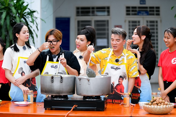 Artists cook porridge for children at the orphanage.