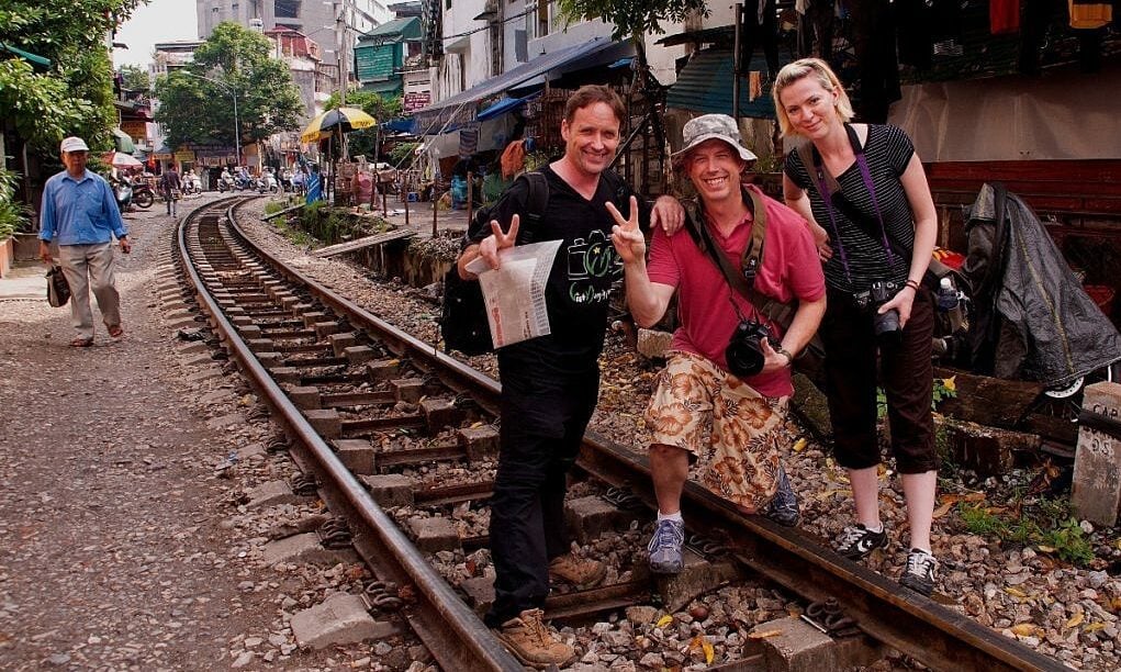 Western man selling tours of Hanoi train street 10 years ago