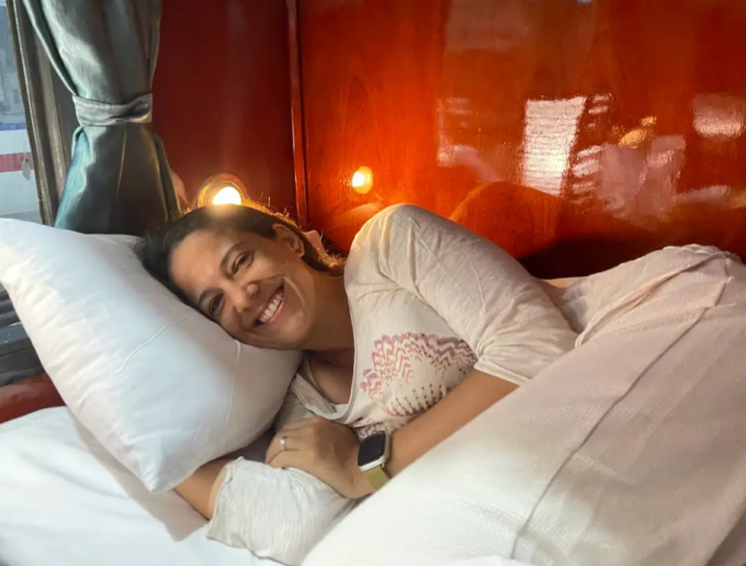 Alezanda Karplus takes a souvenir photo while sleeping overnight on the train. Photo: Insider