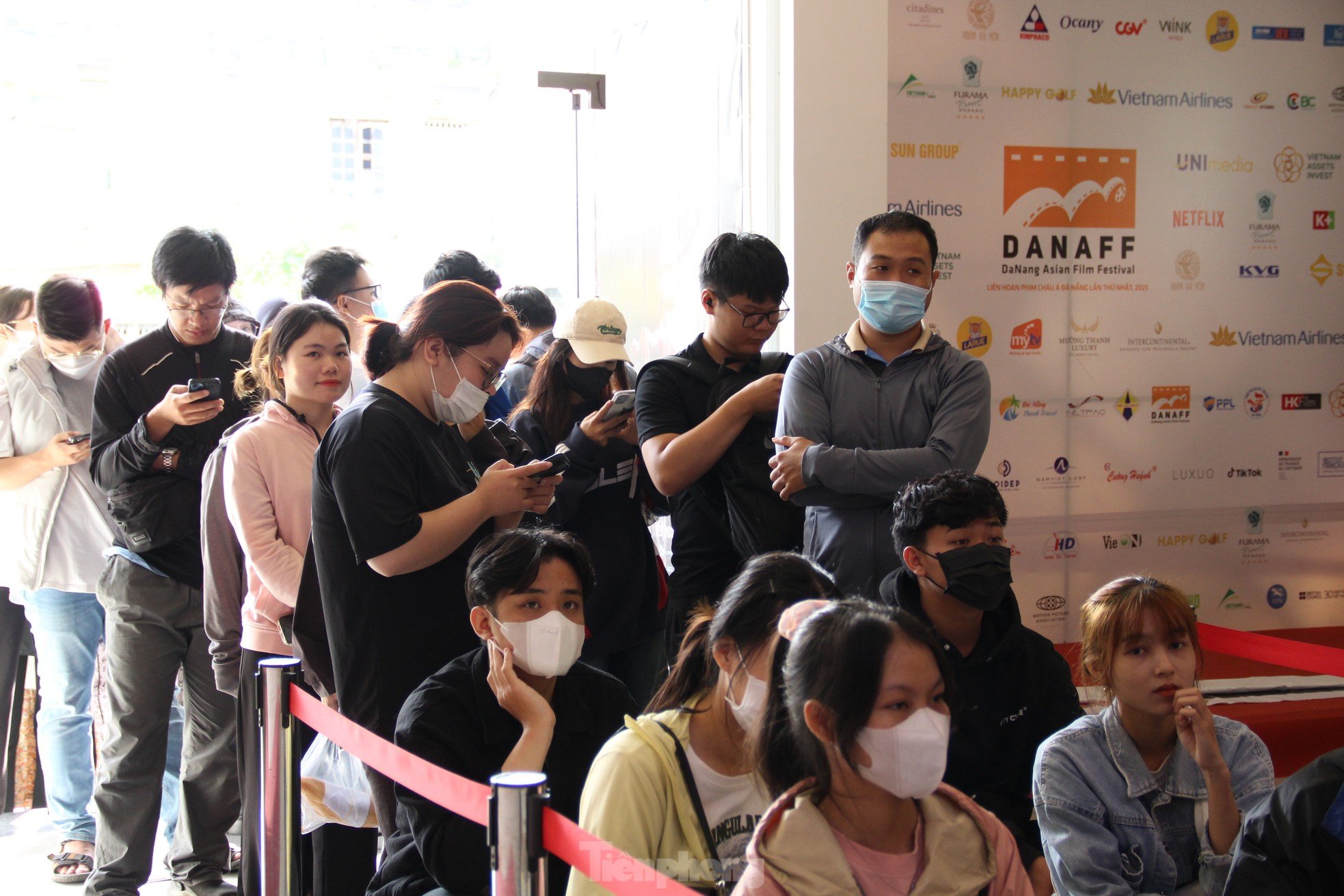 Young people lined up in the sun to buy tickets to see 'Peach, Pho and Piano' photo 13