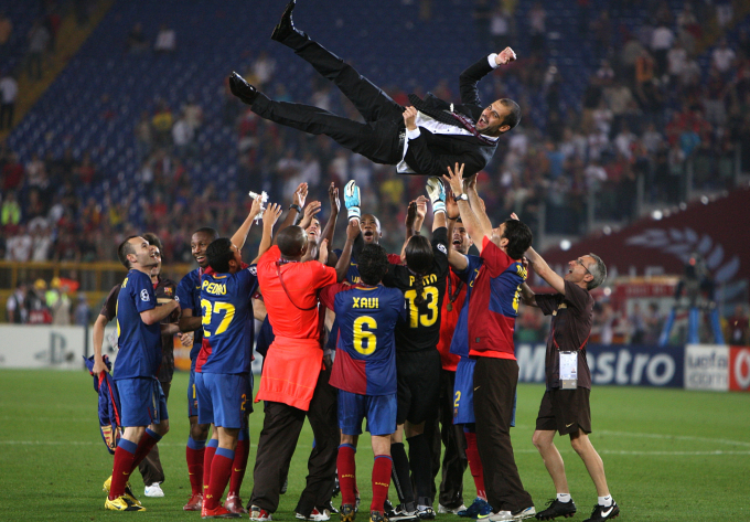 Barca players cheer Guardiola after the 2009 Champions League final win over Man Utd, in Rome, Italy. Photo: PA