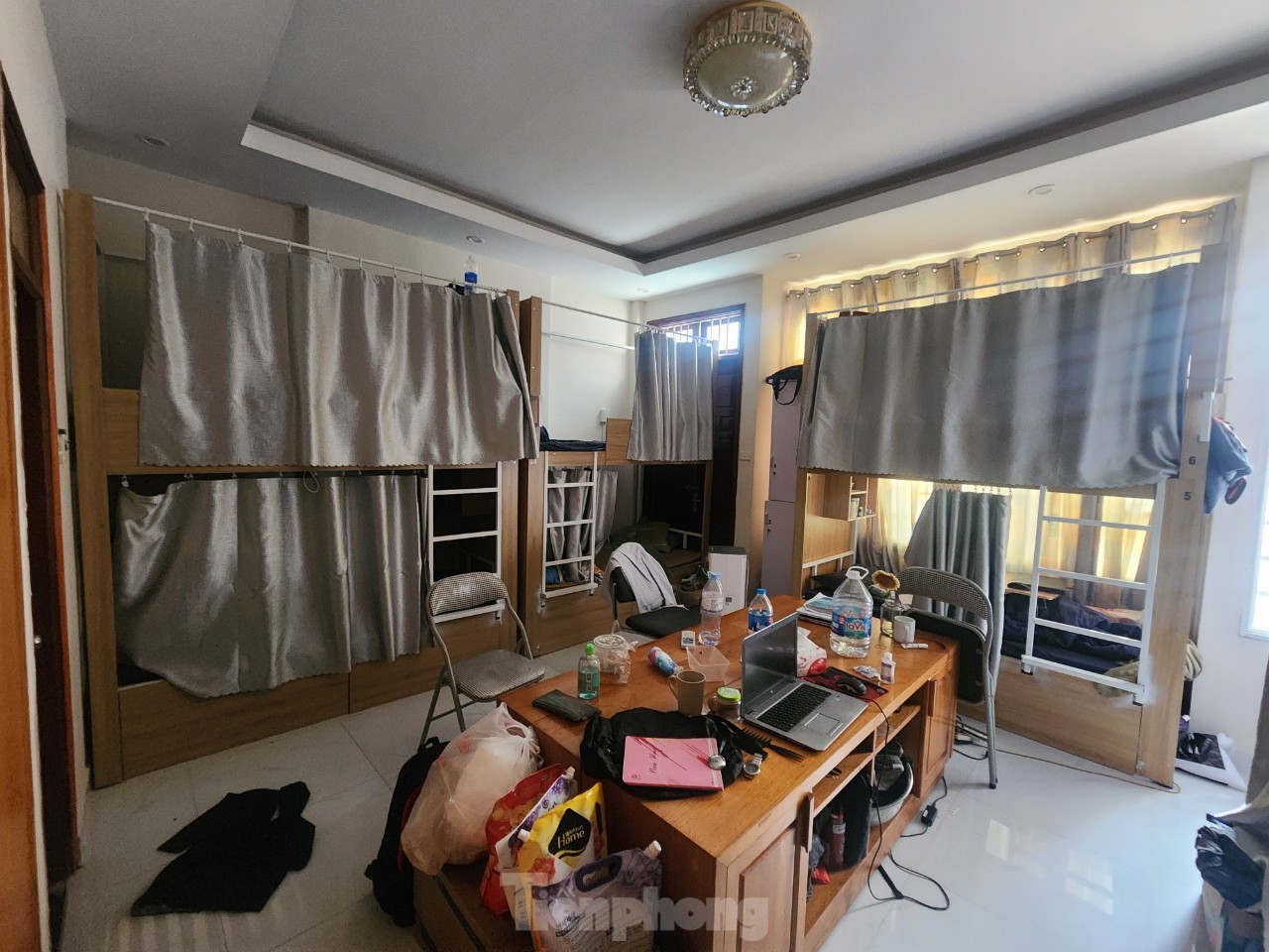 Close-up of a rented room with bunk beds and sleeping boxes at risk of fire and explosion in Hanoi, photo 2