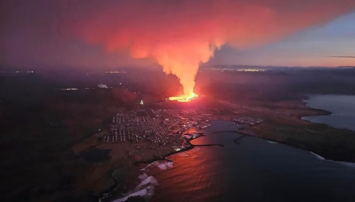 Volcano erupts lava towards fishing village in Iceland