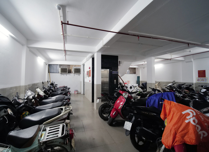 Motorbikes are parked on the first floor of a mini apartment building in Thanh Xuan district. Photo: Ngoc Thanh