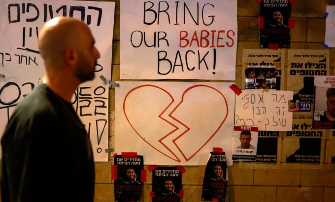 Banners supporting families of kidnapped relatives are posted on a wall in Tel Aviv, Israel, on October 21. Photo: Reuters