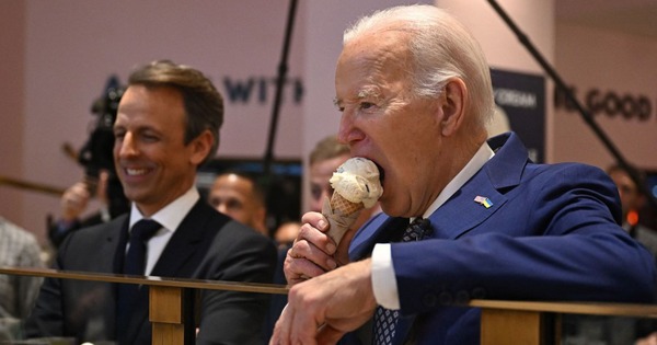 US President Joe Biden eats ice cream cone and waits for food in Gaza