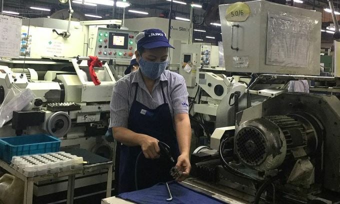 Juki-Fabrikarbeiter während der Produktionszeiten. Foto: An Phuong