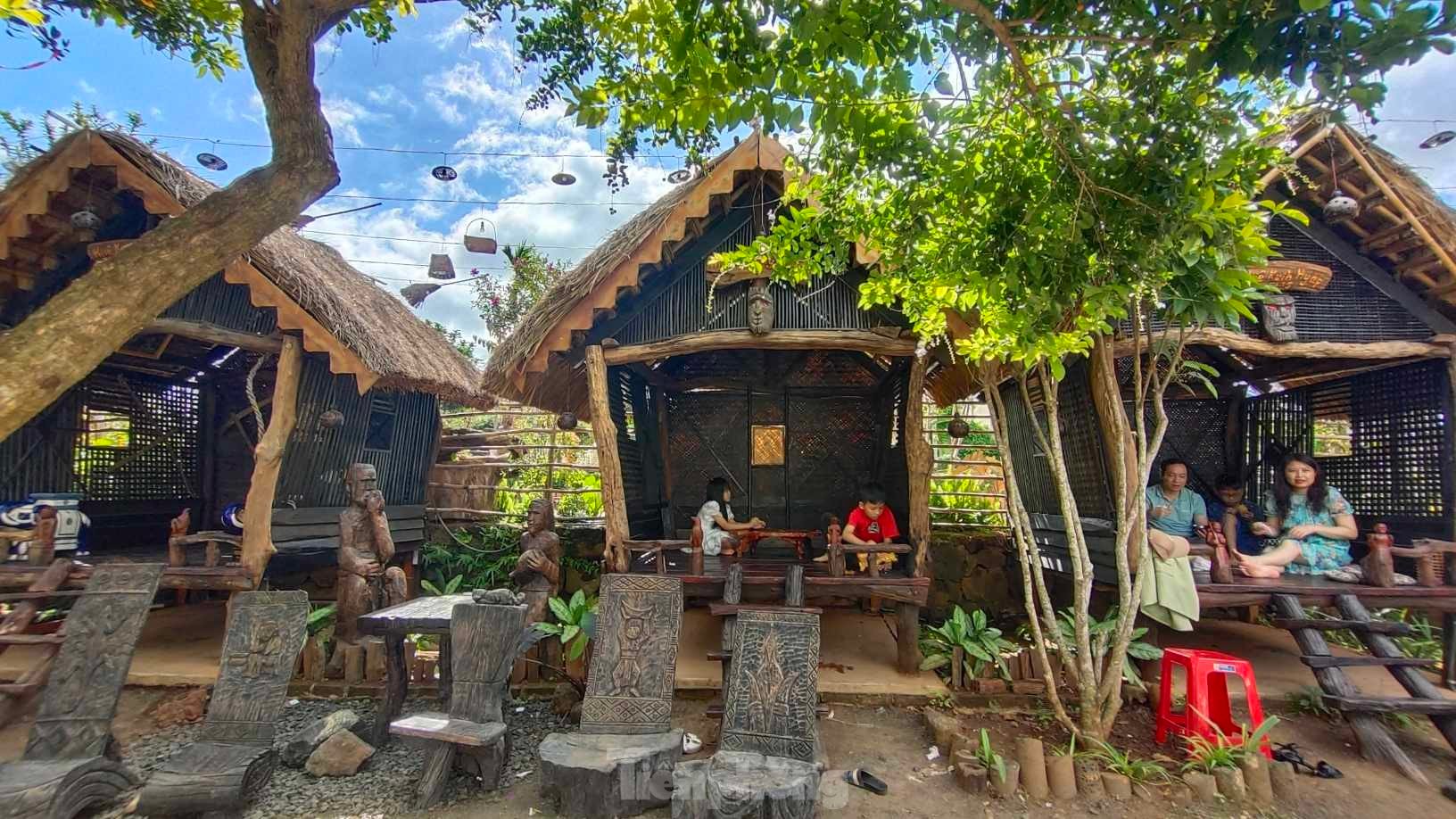 Coffee shop with stilt house and thatched roof attracts young people in mountain town photo 3