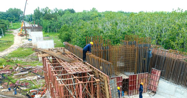 When will Ho Chi Minh road, section through Binh Duong, be open to traffic?