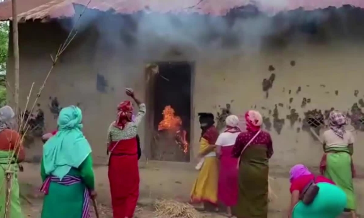 Villagers burn down house of suspect in case of woman forced to parade naked