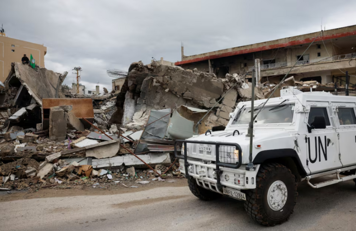 A UN vehicle drives past destroyed buildings in Lebanon after a ceasefire between Israel and Hezbollah came into effect. (Photo: Reuters)