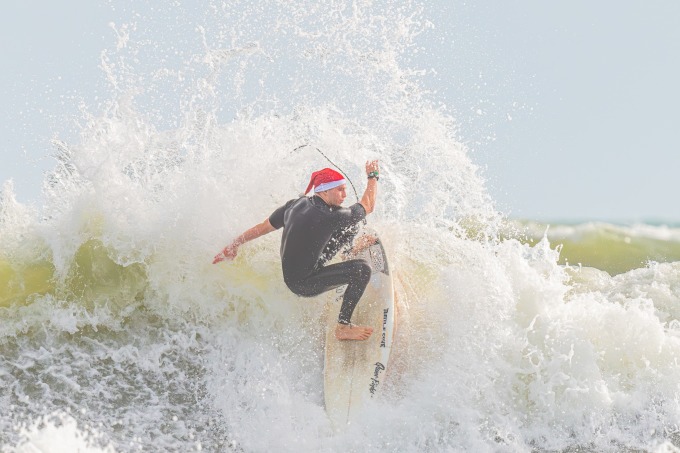 A Santa Claus surfs at Cocoa Beach on December 24. Photo: X/Richard P Gallagher