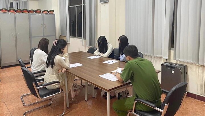 The subjects in the case at the police station.