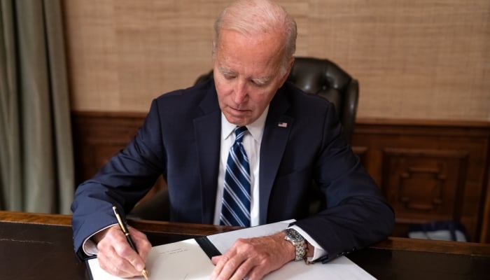 Biden signs bill to prevent US government shutdown at last minute