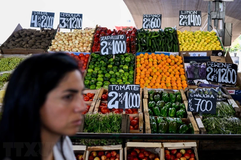 Prices of vegetables and fruits displayed at a market in Buenos Aires on January 9, 2024.