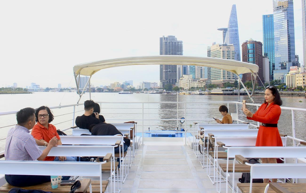 Tourists explore the Saigon River on a double-decker river bus. Photo: Thanh Chan