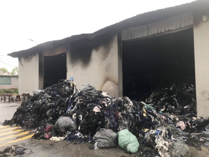 Outside the burnt house and factory. Photo: CACC