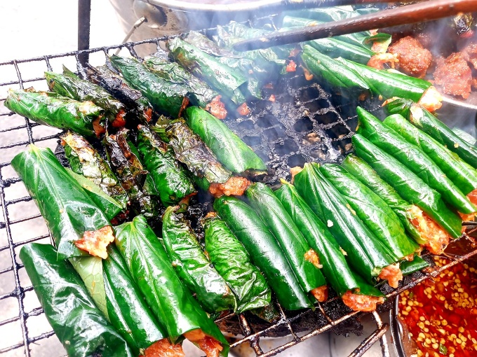 Grilled beef in betel leaves over hot coals. Photo: Khanh Thien