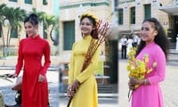 Beautiful ladies wearing Ao Dai on the street on the first day of the new year 2022