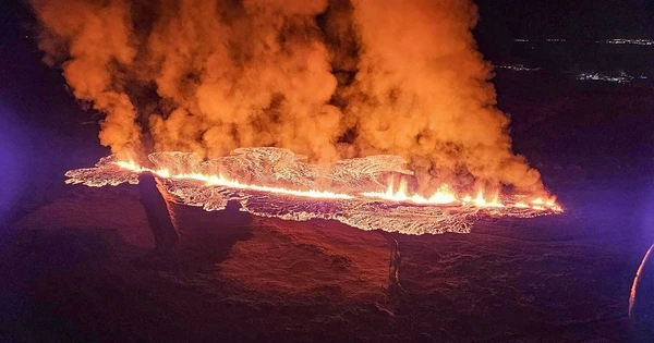 Volcano erupts in Iceland, red lava threatens town