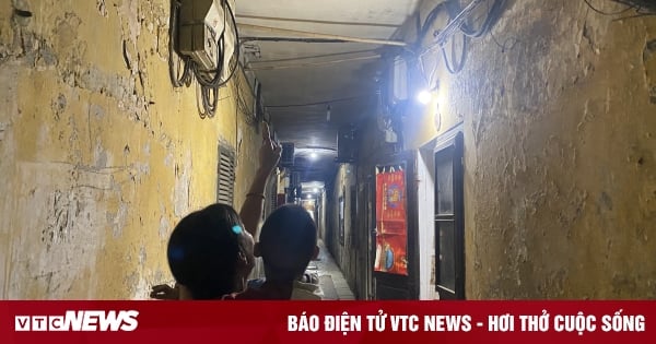 Inside a dilapidated apartment building in Hanoi, every time it rains, the house leaks and water floods.