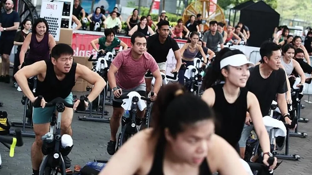 Tập luyện ở nơi có nhiệt độ cao giúp cơ thể thích ứng với nắng nóng. Ảnh: STRAITS TIMES