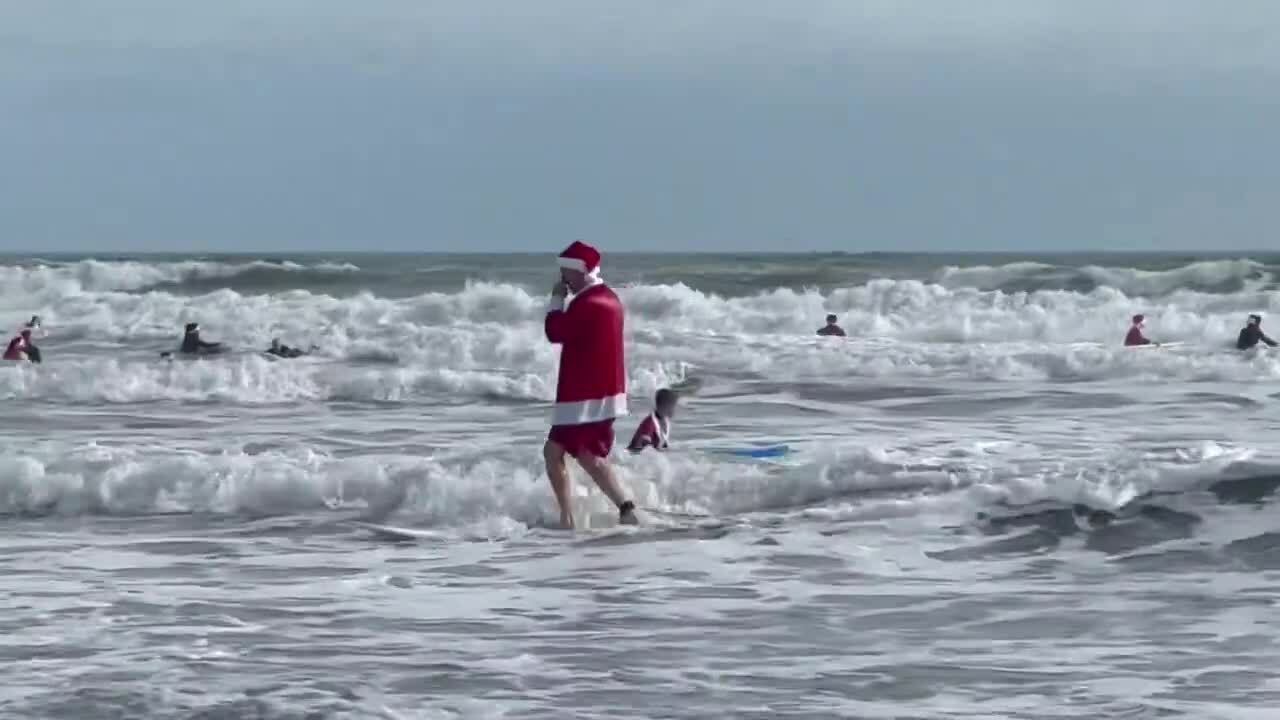 Santa surfs to raise funds in Florida