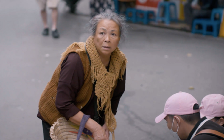 Thanh Quy as the hard-working, miserable Mrs. Tinh in 