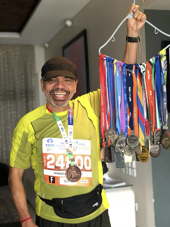 Venkatesh Prabhu and more than 50 medals from marathon races. Photo: Venkatesh Prabhu