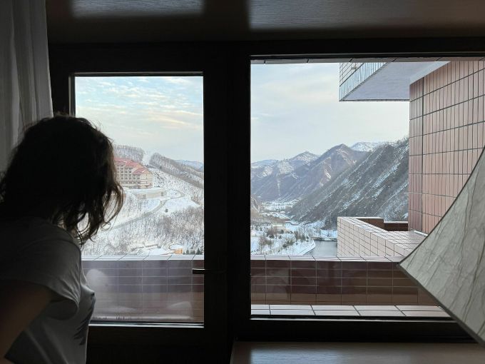 Lena Bychcova sits in her room and looks out at the Masikryong ski resort. Photo: CNN