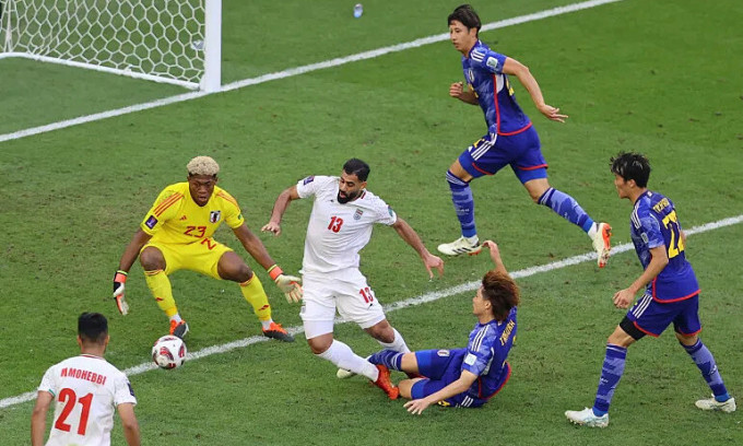 Center-back Ko Itakura's unfortunate tackle on Hossein Kanani. Photo: Reuters